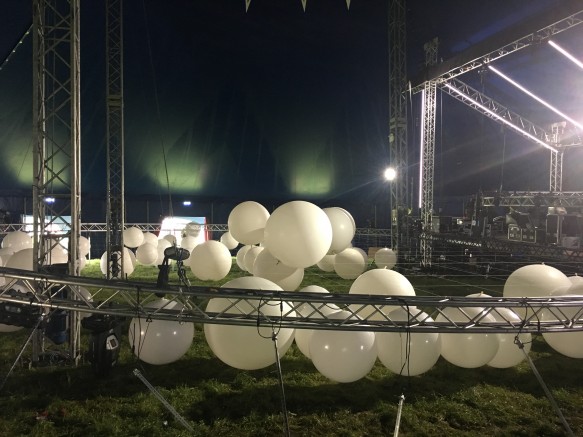Balloons being inflated and placed inside the truss and attached to the drop lines
